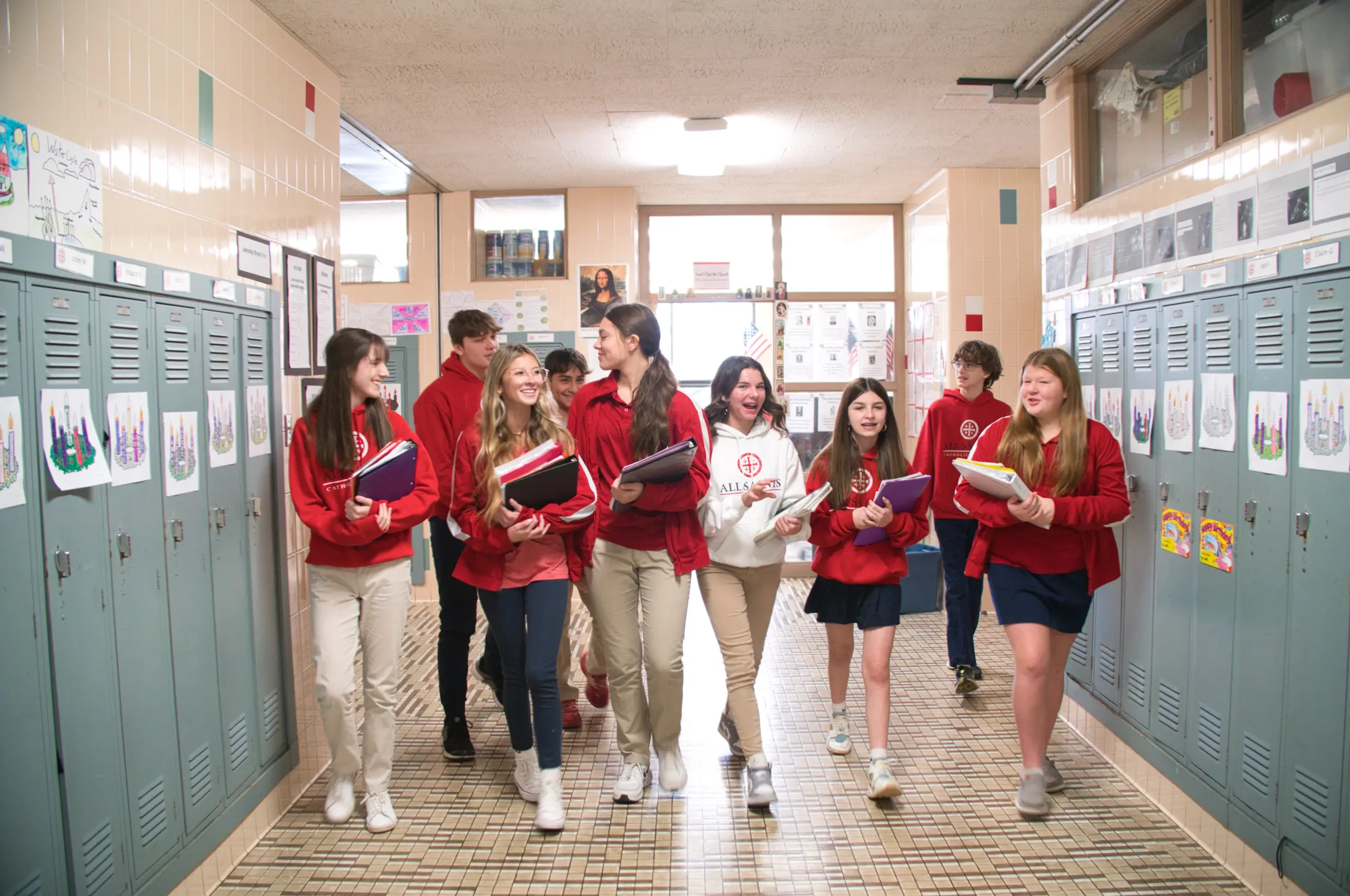 Student at all saints catholic school walking the halls.